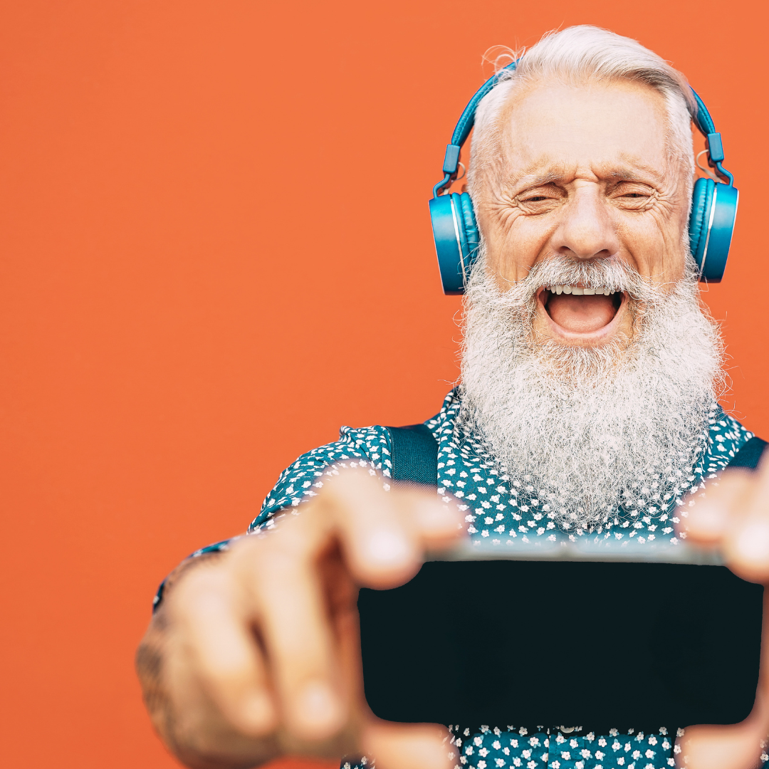 Senior man headphones and mobile