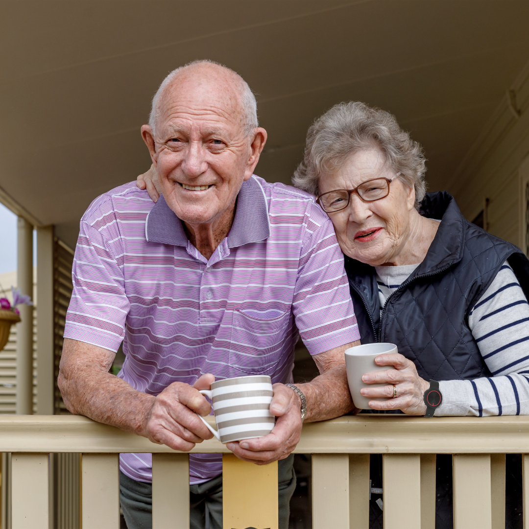 Senior couple drinking tea on porch