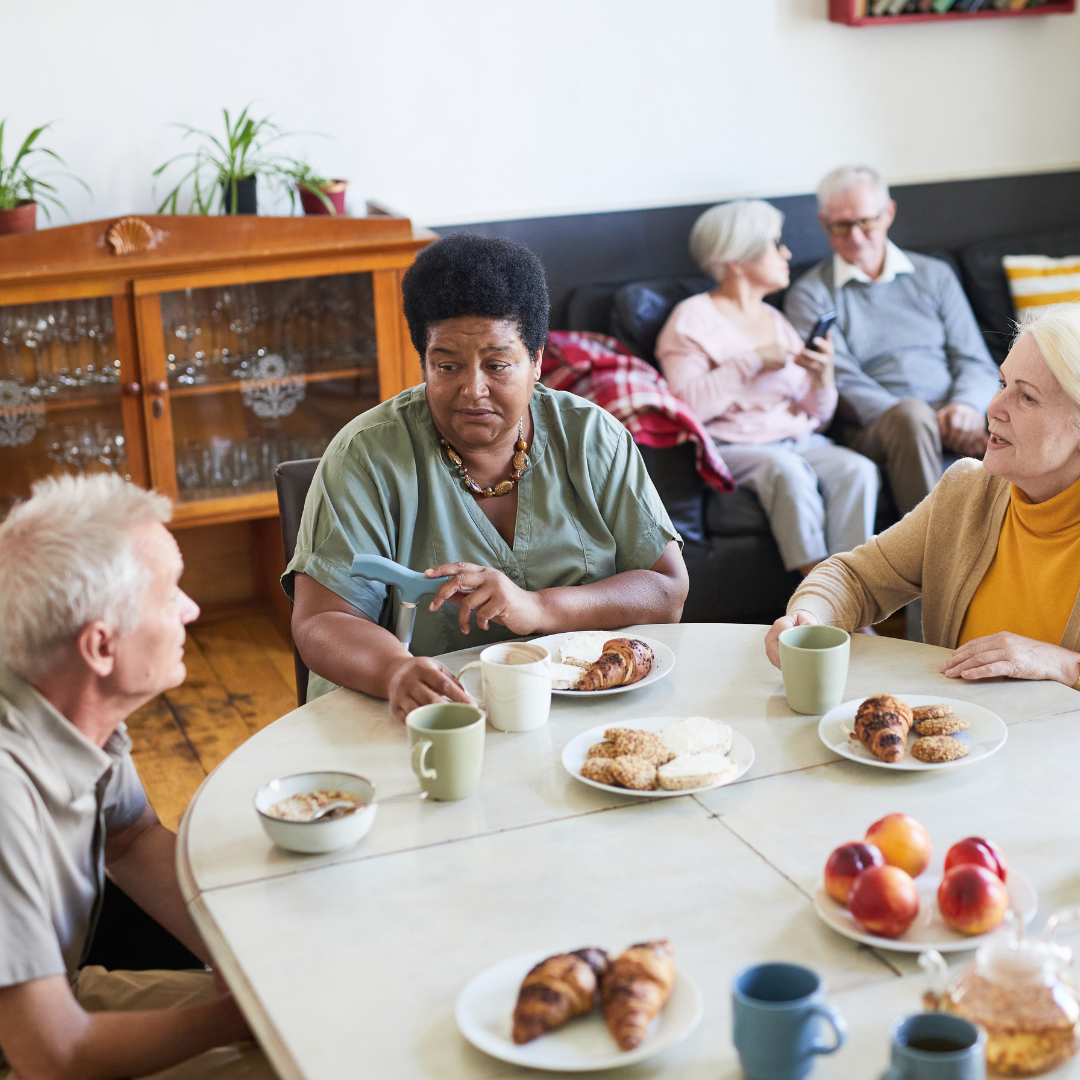 People chatting in a care home setting