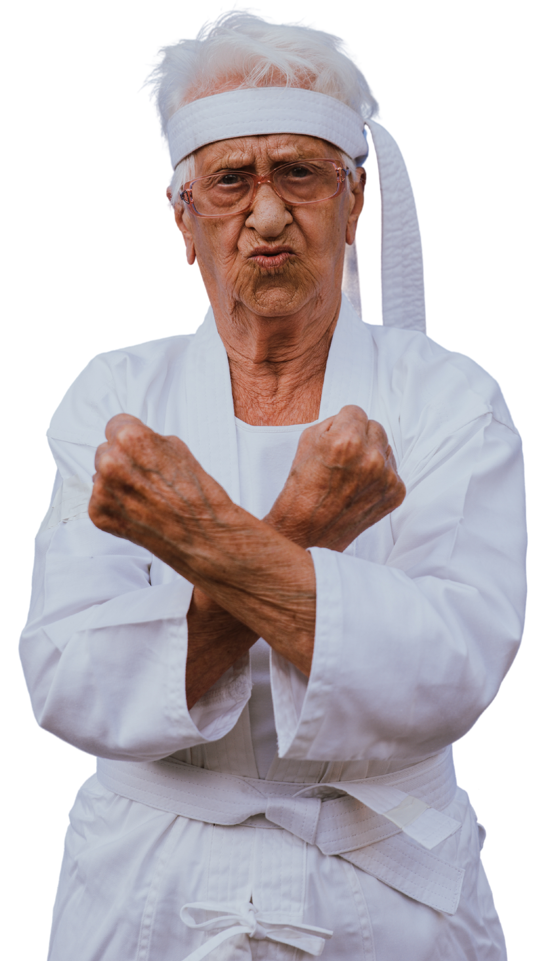 A senior lady dressed in a karate suit