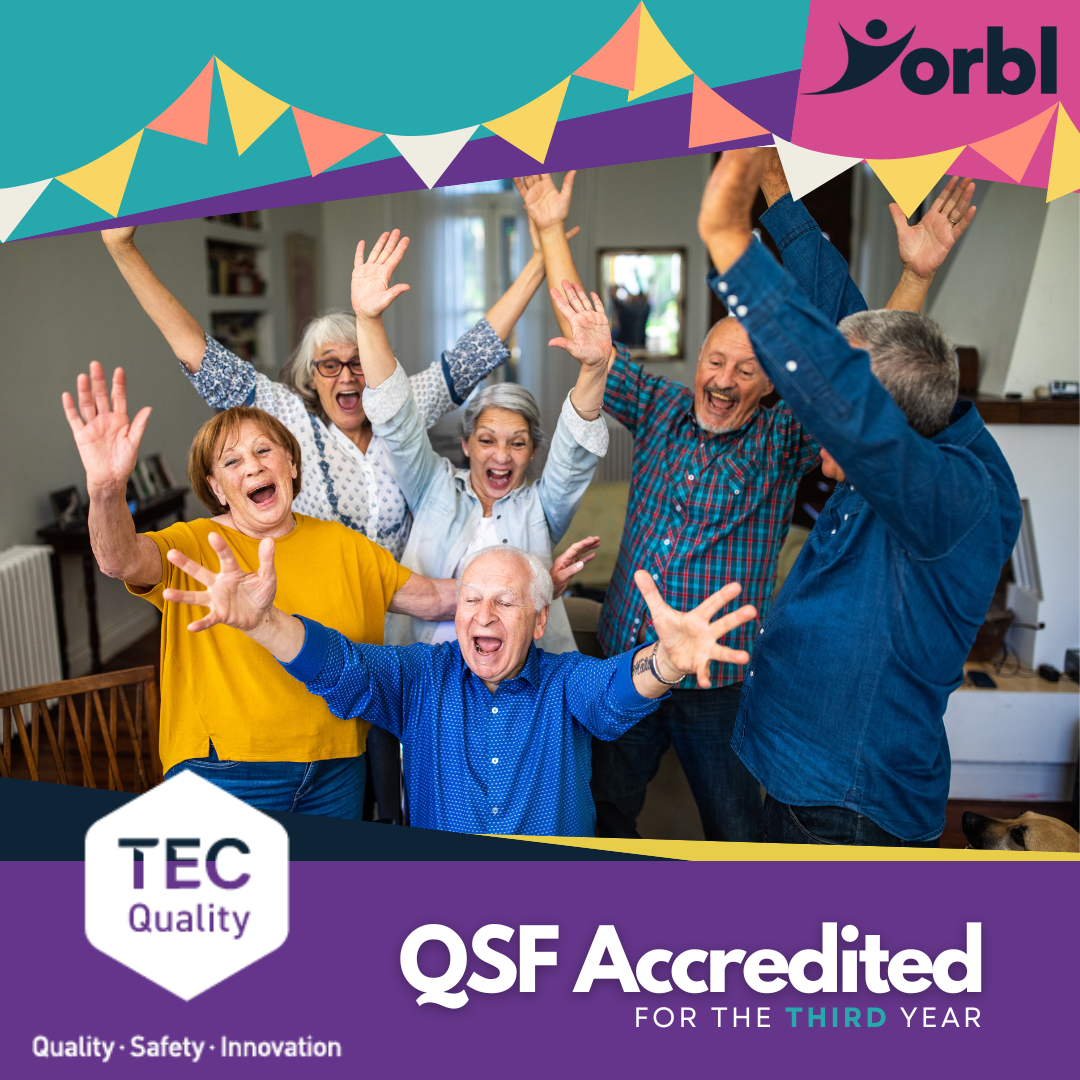 A group of elderly men and women celebrating the success of an outcome is used to portray Yorbl's QSF accreditation for the third year running.